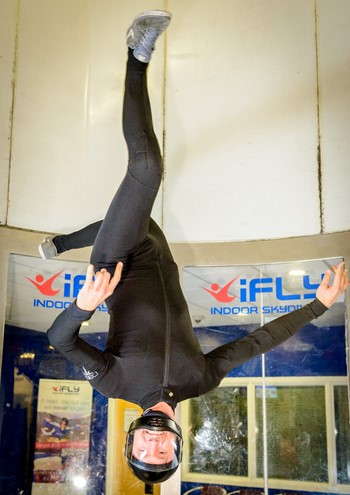 Person doing a flip while flying at iFLY