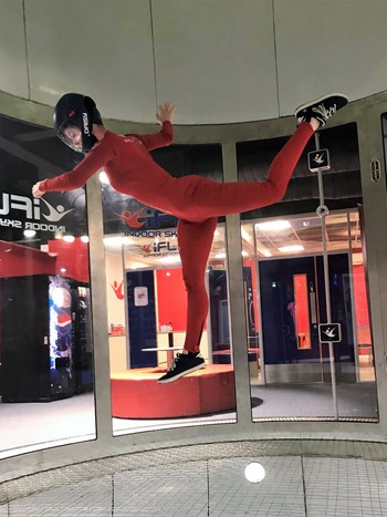 Person in a weird pose flying at iFLY 2