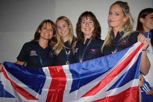 Five people with British flag