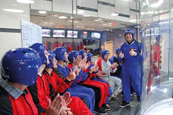 Group of people sitting down at iFLY