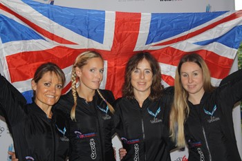 Four people with a British flag