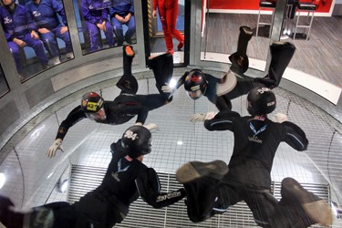 Four people flying at iFLY