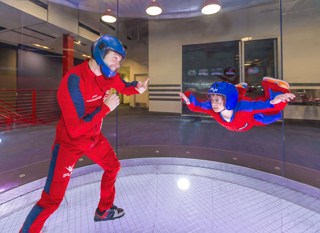 A kid and a grown up flying at iFLY